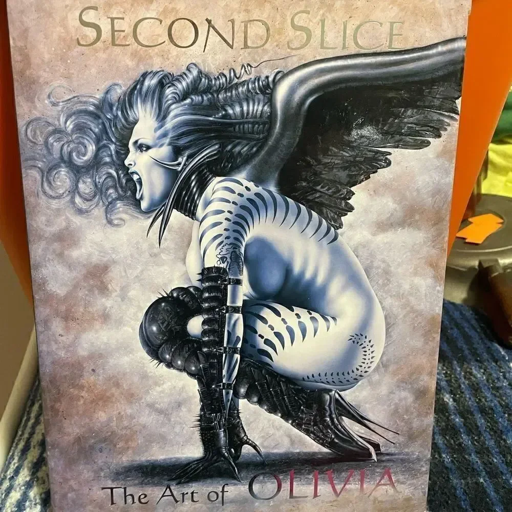 Second Slice The Art of Olivia Hardback Book